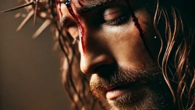 Close-up image of Jesus Christ wearing a crown of thorns, with blood dripping from his forehead, symbolizing the suffering during the crucifixion